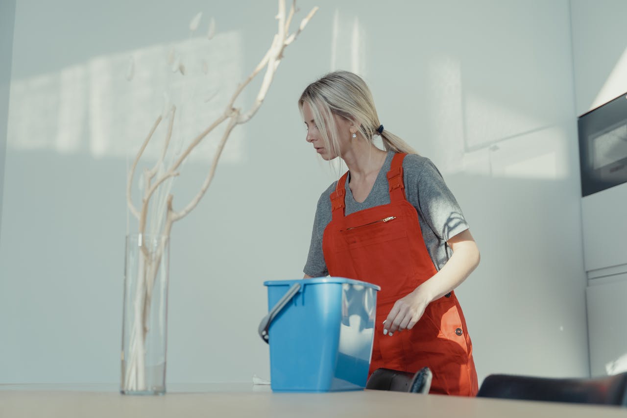 Woman in Gray Shirt and Orange Jumpsuit